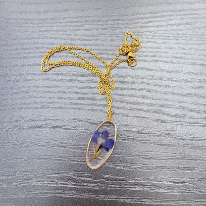 Collier oval doré inclusion de la fleur de Lobélia bleu cadeau pour elle - Lorred